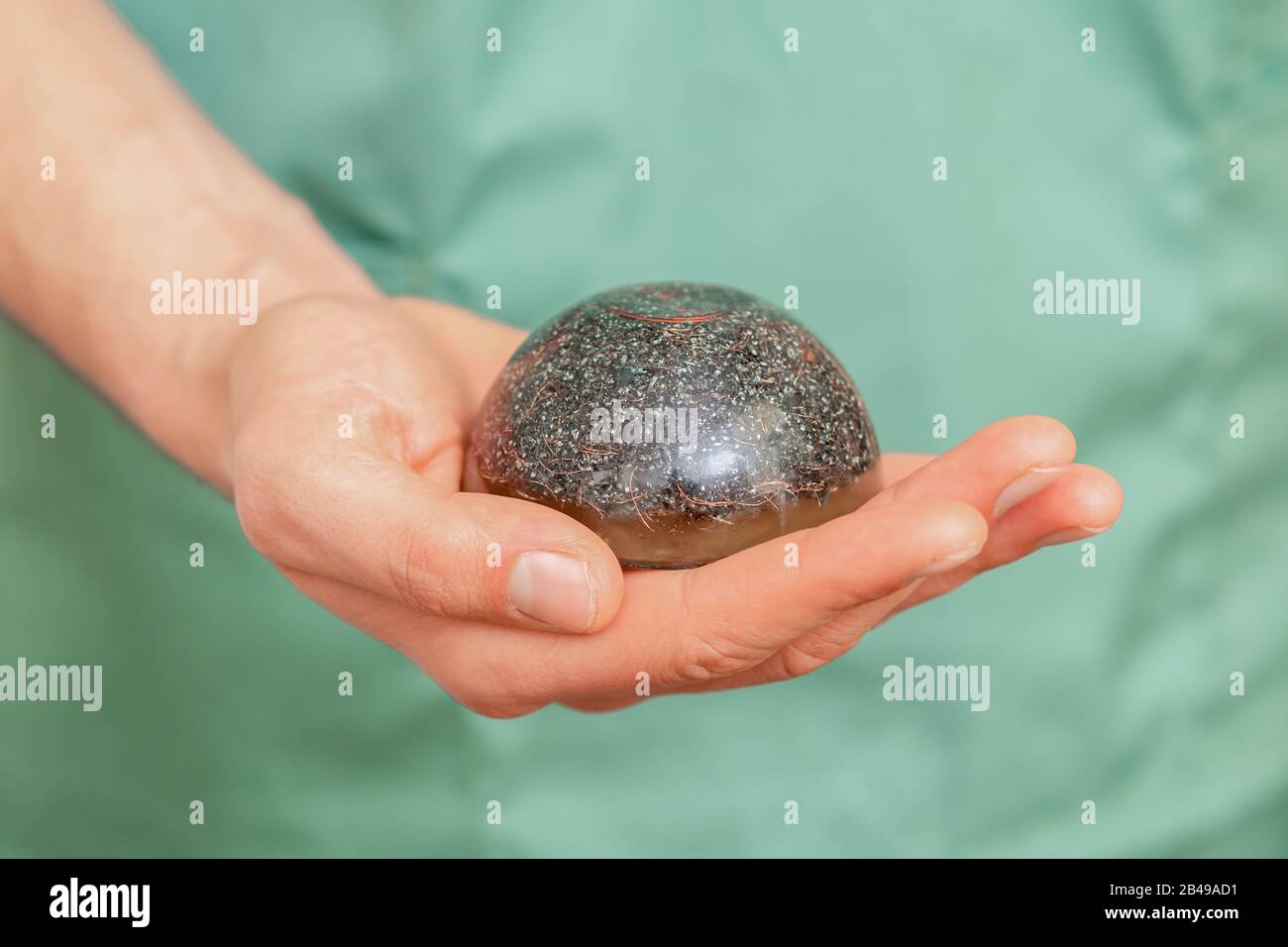 Massage stone in hand of massage therapist, close up Stock Photo Alamy