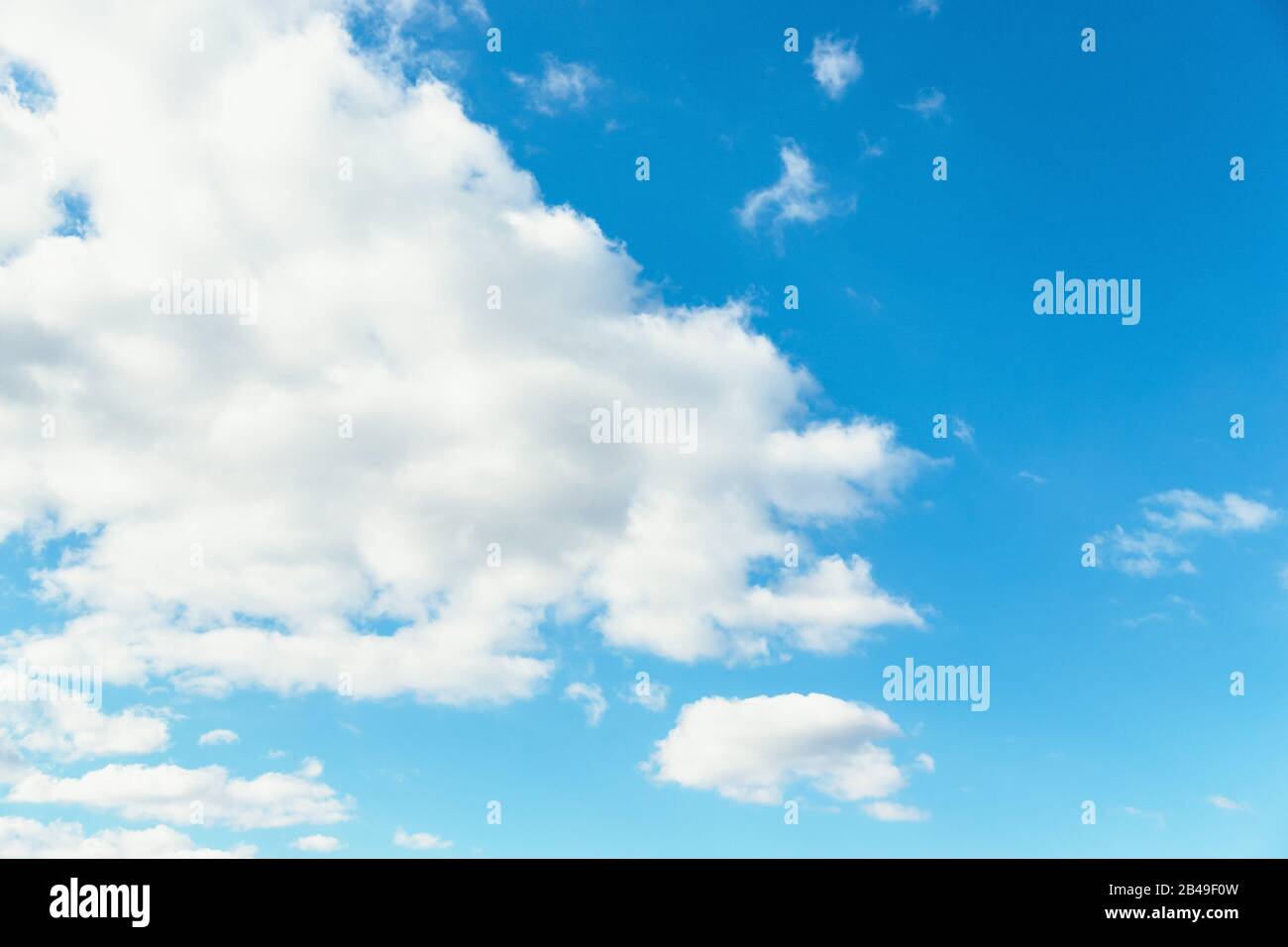 Blue sky background. Blue sky with fluffy white clouds. Copy space ...
