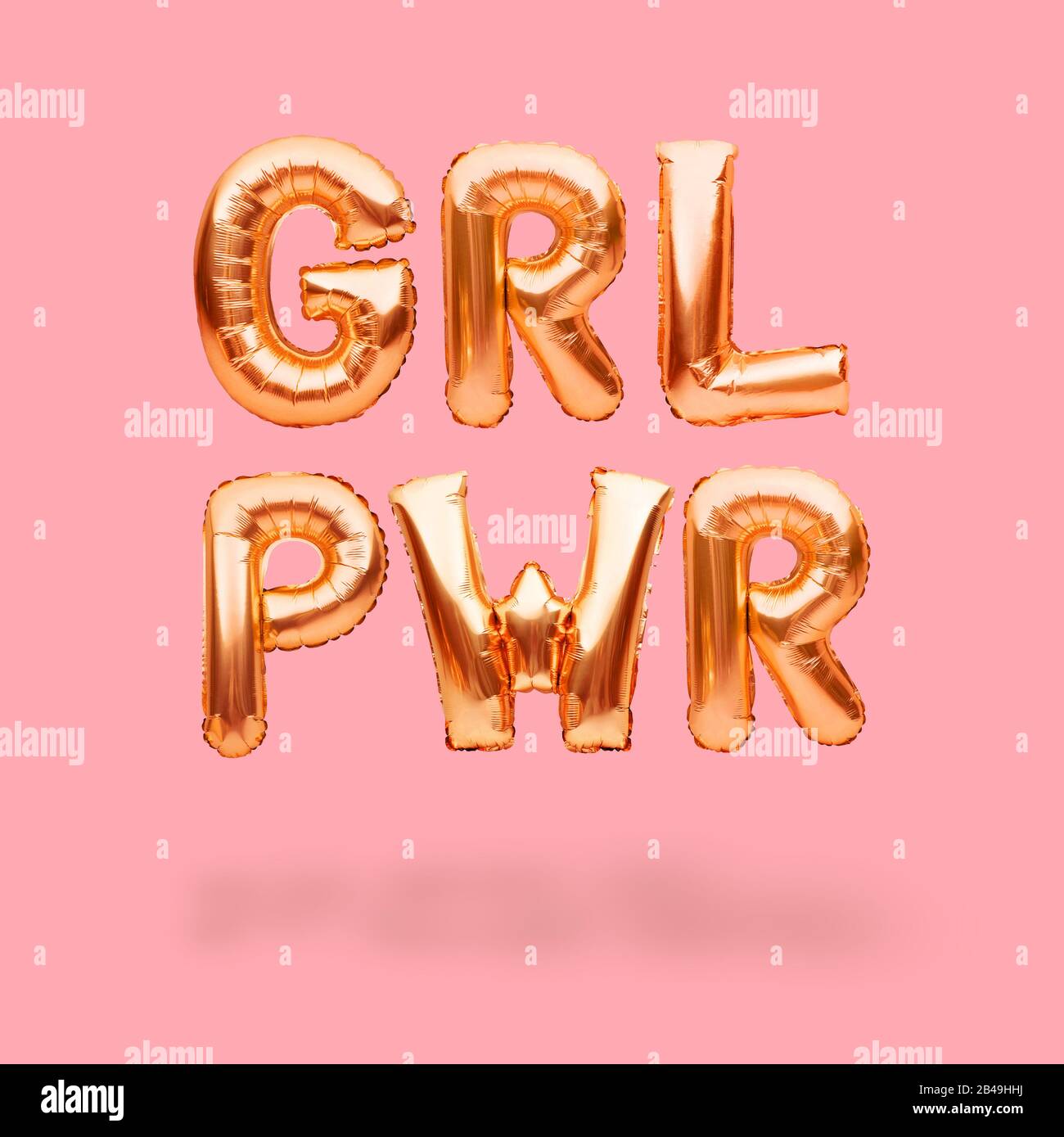 Lettering GRL PWR or girl power made of golden inflatable helium ...