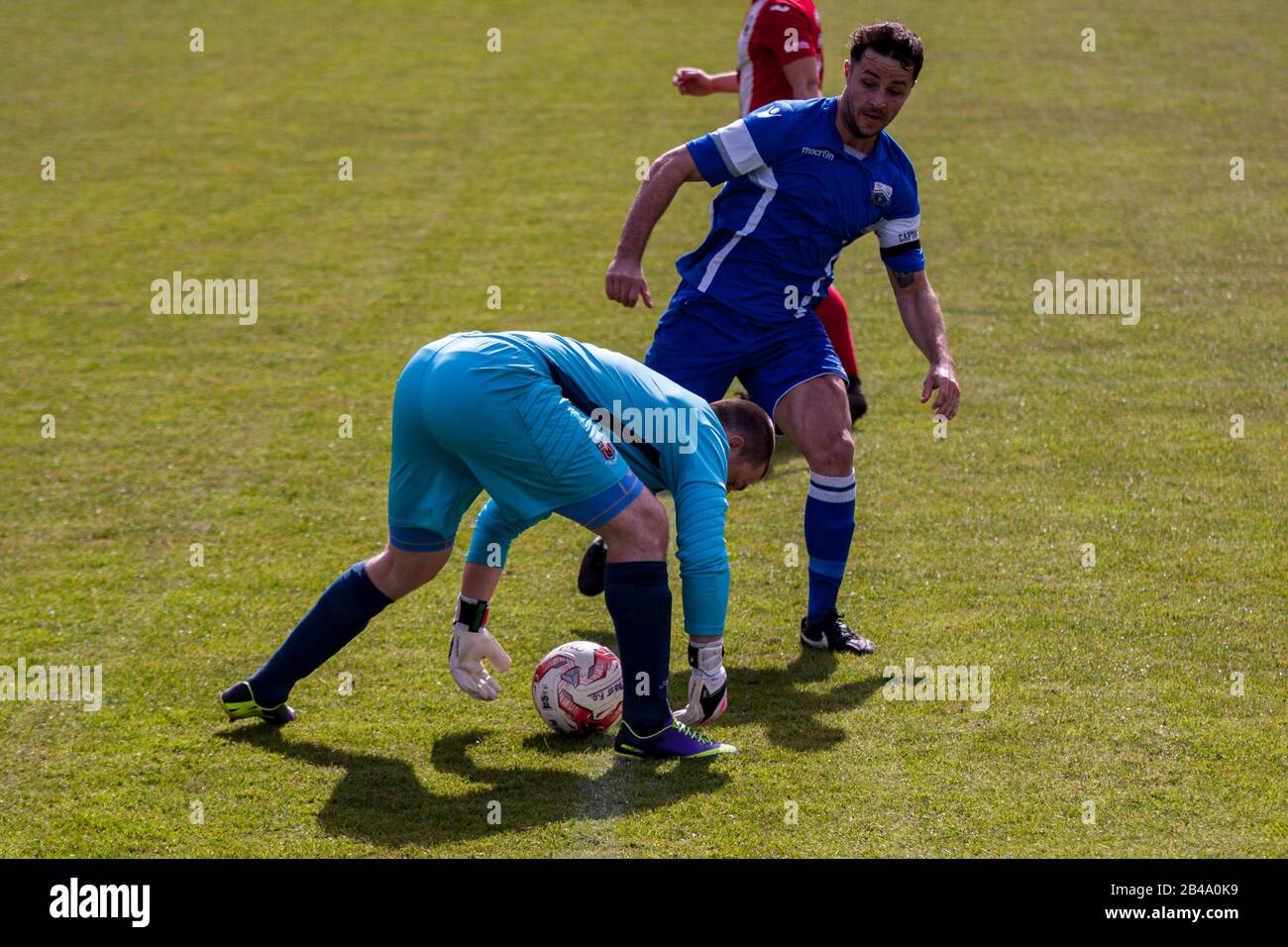 Luke Bowen of Port Talbot Town (R) in action against Undy Athletic. Stock Photo