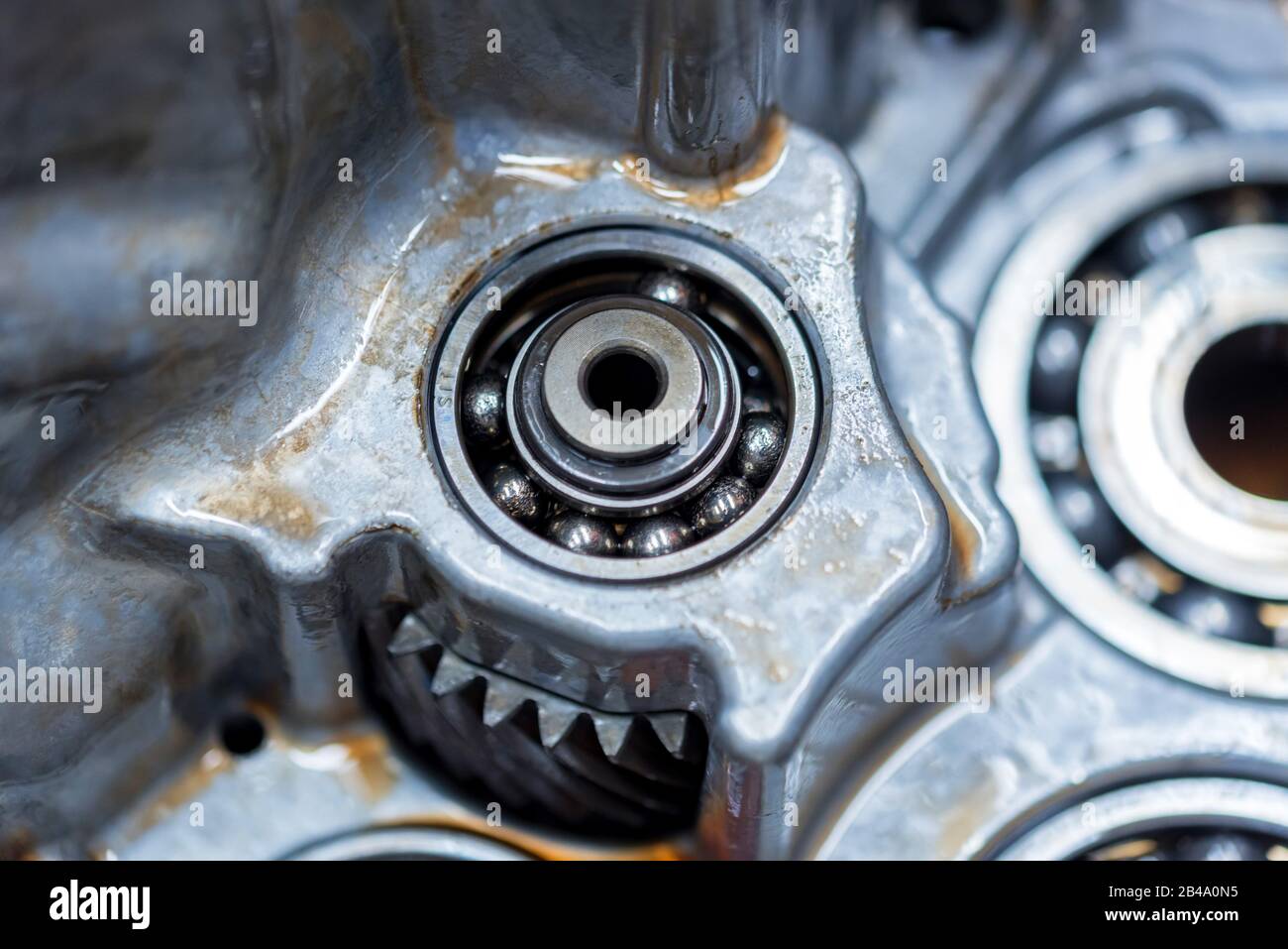 Broken ball bearing inside vehicle automatic transmission. Close up