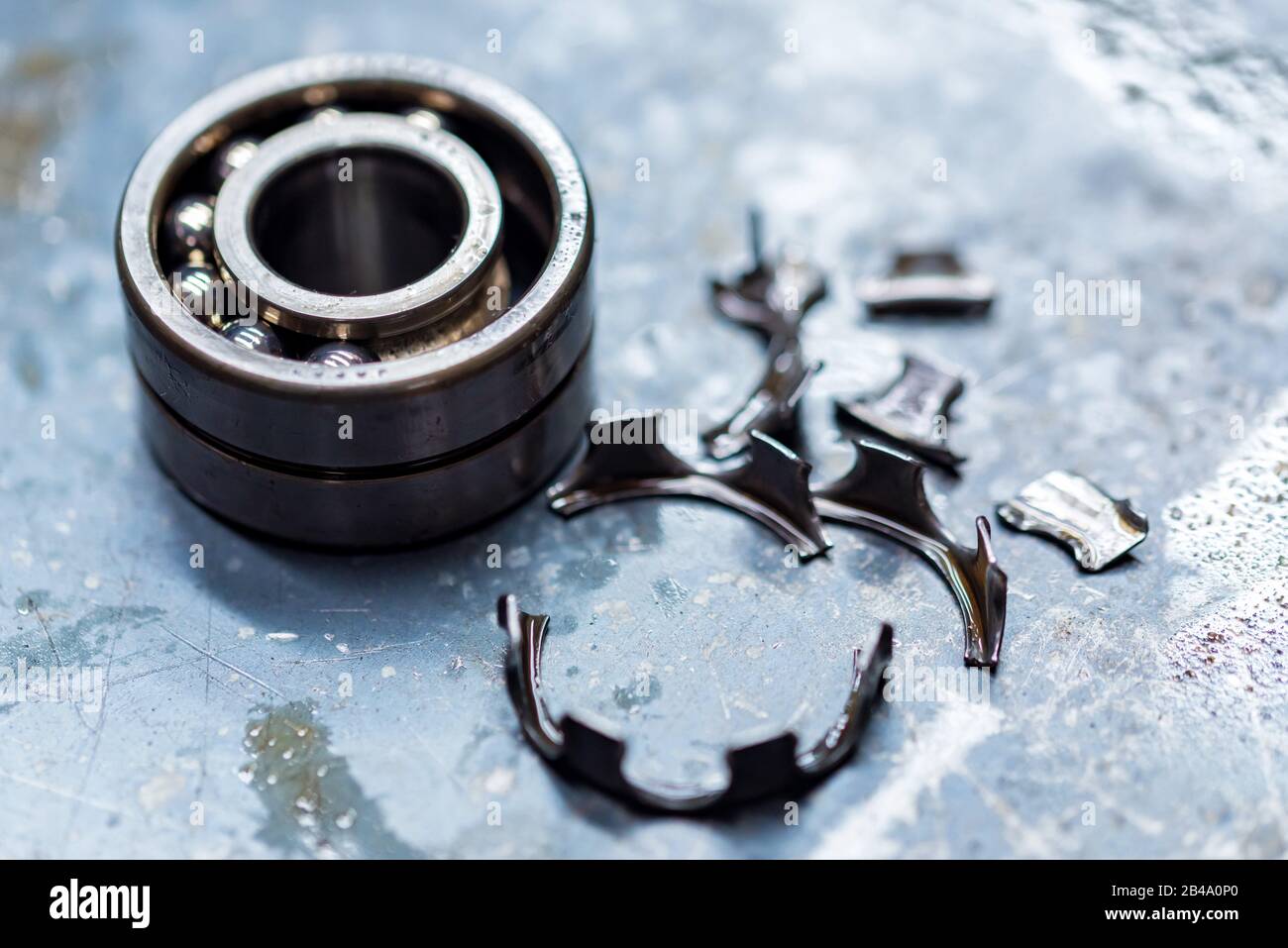 Broken ball bearing inside vehicle automatic transmission. Close up