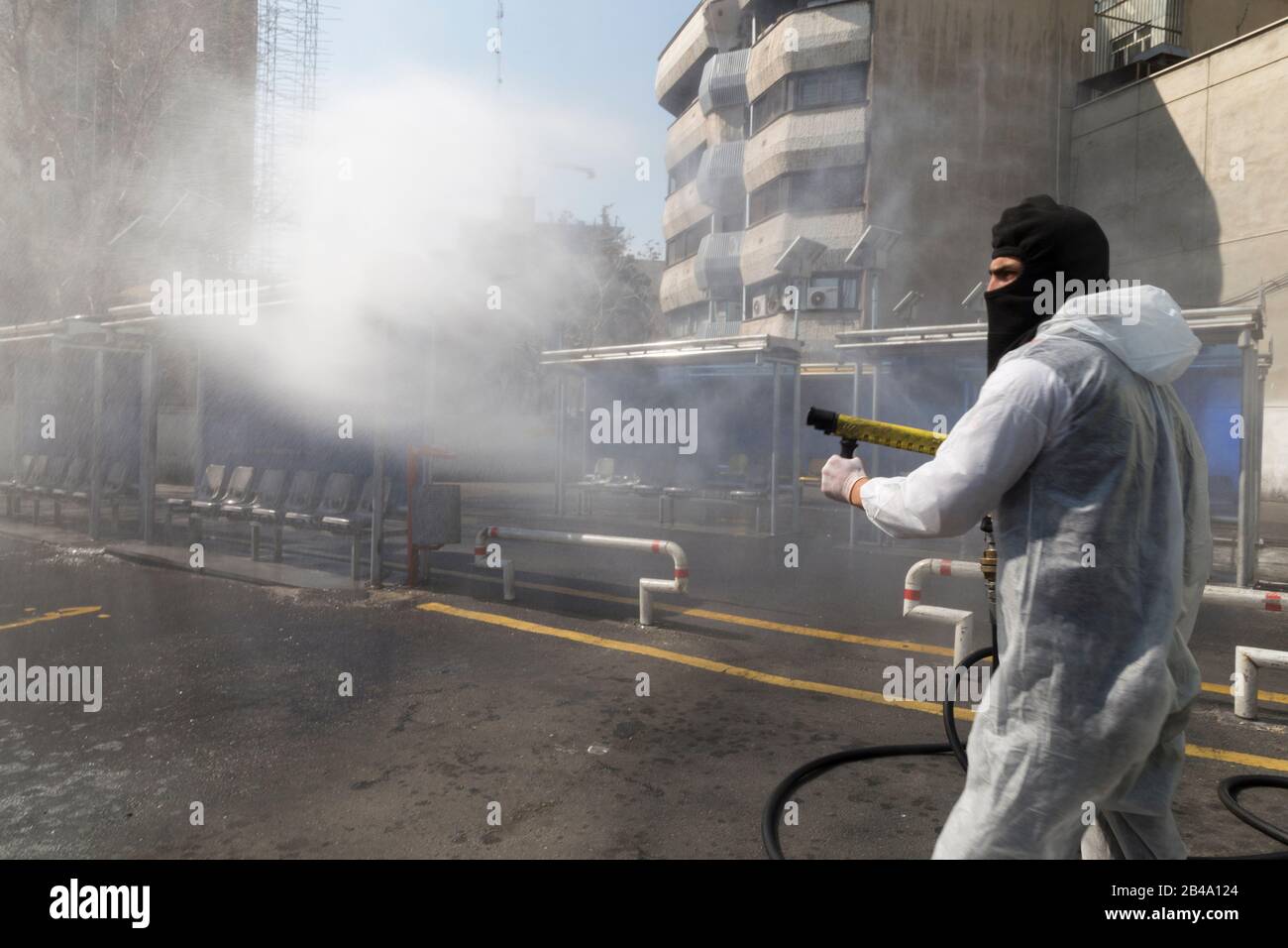 Tehran, Iran. 6th Mar, 2020. Firefighters and municipality workers with protective suits disinfect the streets, buses, and taxies as a precaution to the coronavirus (Covid-19) in Vanak square of northern Tehran, Iran. Iranian officials canceled Friday prayer for the second week due to concerns over the spread of coronavirus and COVID-19. According to the last report by the Ministry of Health, there are 4,747 COVID-19 cases in Iran. 147 people have died so far. A Health Ministry spokesman warned authorities could use unspecified 'force' to halt travel between major cities. (Credit Image: © Ro Stock Photo