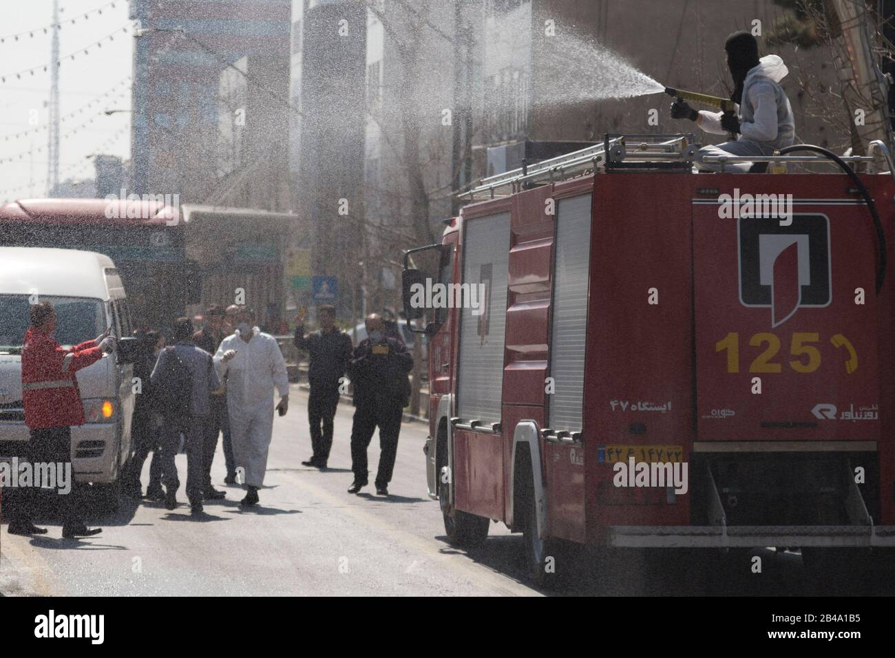 Tehran, Iran. 6th Mar, 2020. Firefighters and municipality workers with protective suits disinfect the streets, buses, and taxies as a precaution to the coronavirus (Covid-19) in Vanak square of northern Tehran, Iran. Iranian officials canceled Friday prayer for the second week due to concerns over the spread of coronavirus and COVID-19. According to the last report by the Ministry of Health, there are 4,747 COVID-19 cases in Iran. 147 people have died so far. A Health Ministry spokesman warned authorities could use unspecified 'force' to halt travel between major cities. (Credit Image: © Ro Stock Photo