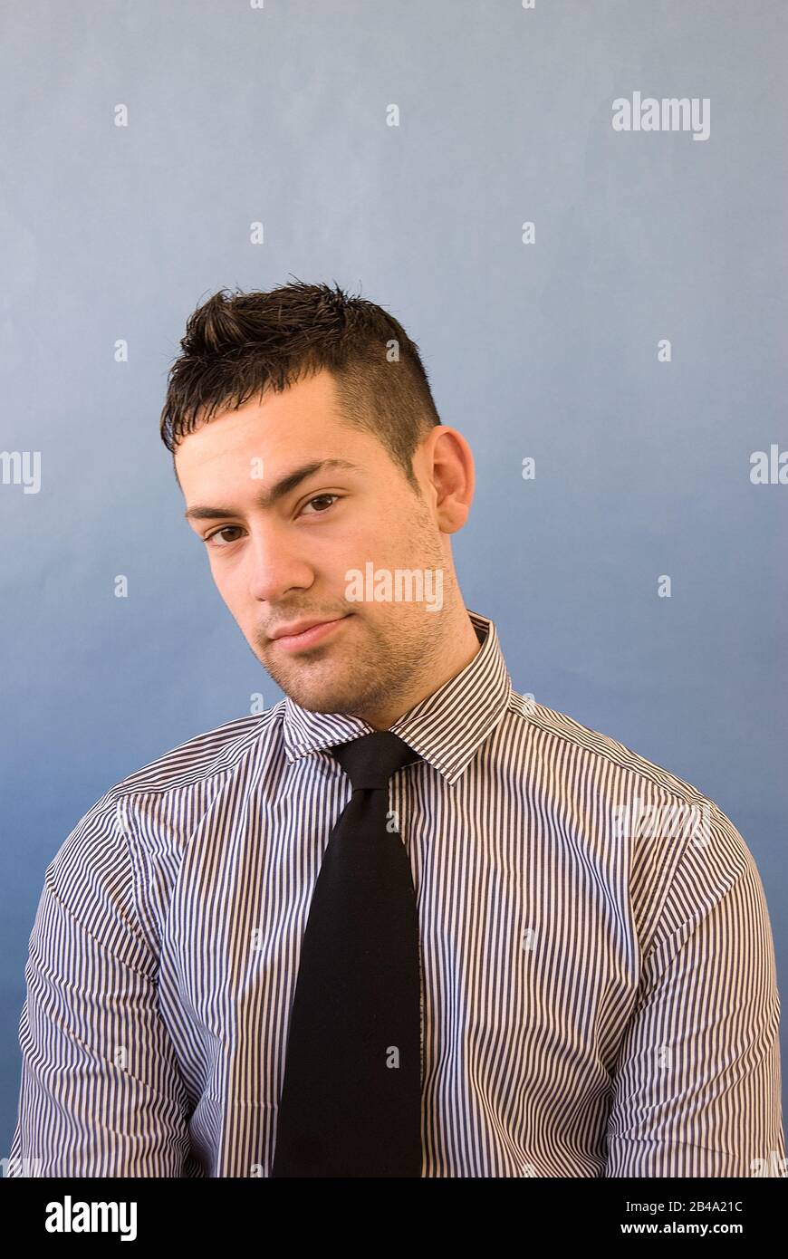 Young man looking at the camera Stock Photo - Alamy