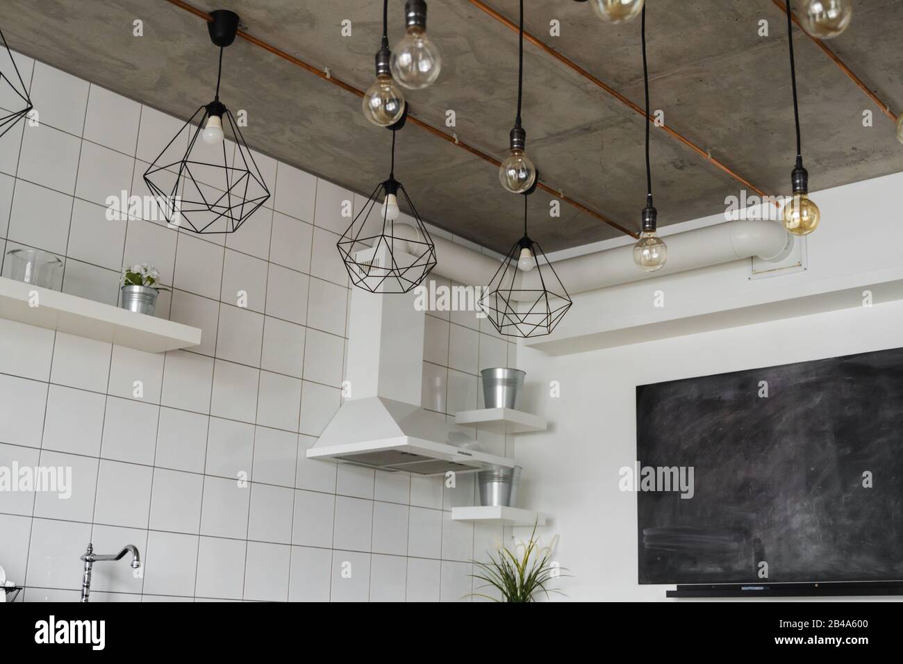 Kitchen hood in Modern, bright, clean, kitchen interior with stainless ...