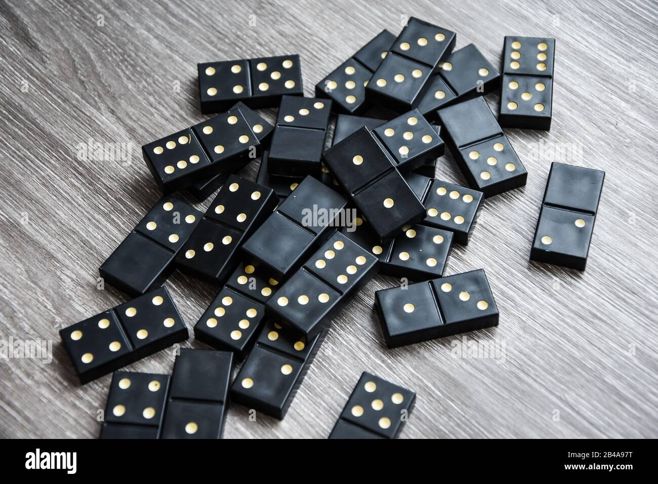 Black Dominoes game block on a colored background Stock Photo - Alamy