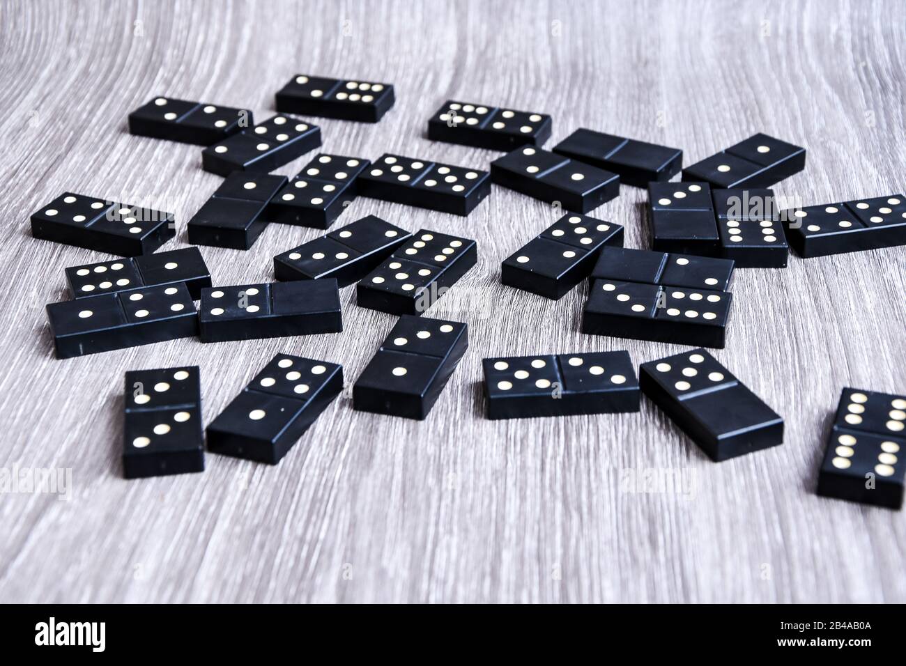 Black Dominoes game block on a colored background Stock Photo - Alamy