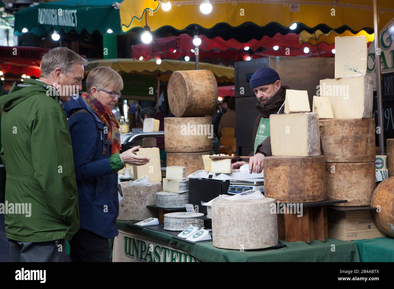London, UK. 6th March, 2020. Londoners and tourists took advantage of a sunny day to visit the famour Borough food market without wearing facemasks, showing a 'business as usual' attitude to the Corvid-19 coronavirus. Anna Watson/Alamy Live News Stock Photo