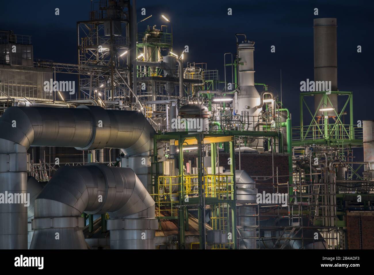 bright illuminated plant of chemical industry by night Stock Photo