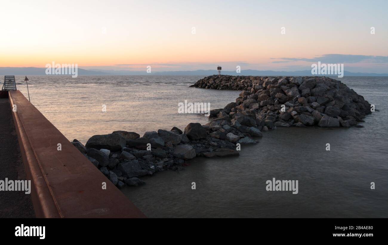 Jetty of rocks at the marina on the shore of Saint Lawrence river, Canada Stock Photo