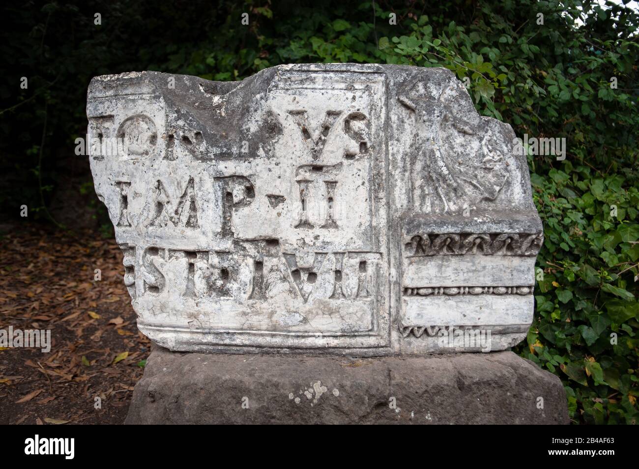 Broken marble stone with latin inscription on display at the Forum, Rome Stock Photo