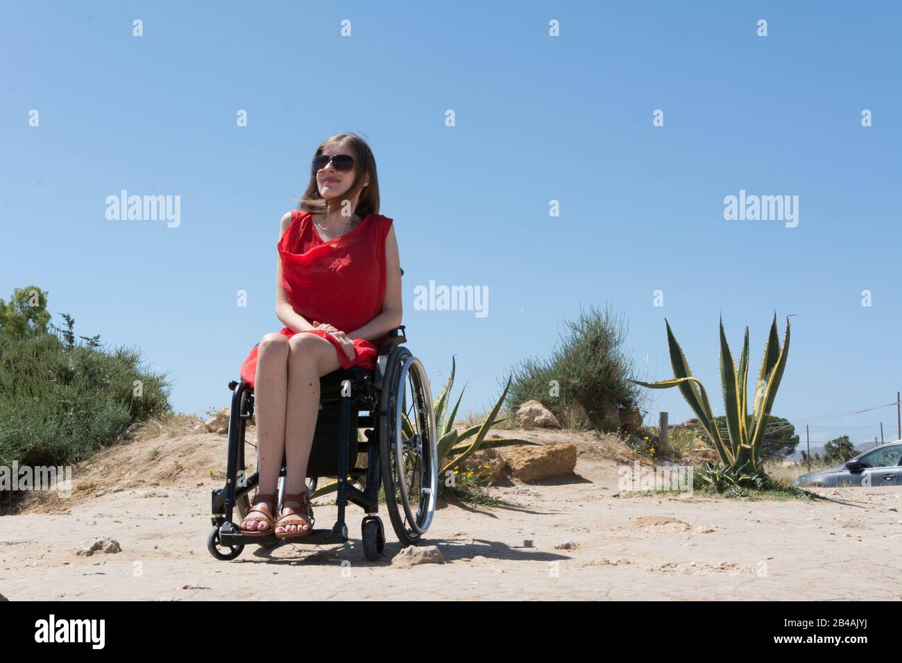 Woman in wheelchair in the countryside Stock Photo