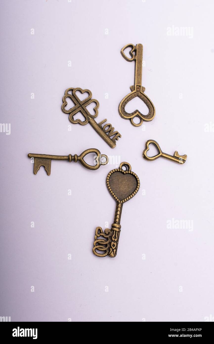 Heart shaped retro metal keys on white background Stock Photo - Alamy