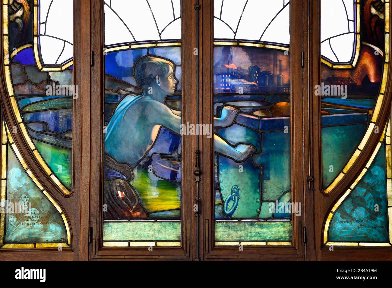 France, Meurthe et Moselle, Nancy, Art Nouveau building of the Chamber of Commerce and Industry (CCI), stained glass on the ground floor representing the strengths of Lorraine industry designed by Jacques Gruber, iron exploitation and work Stock Photo
