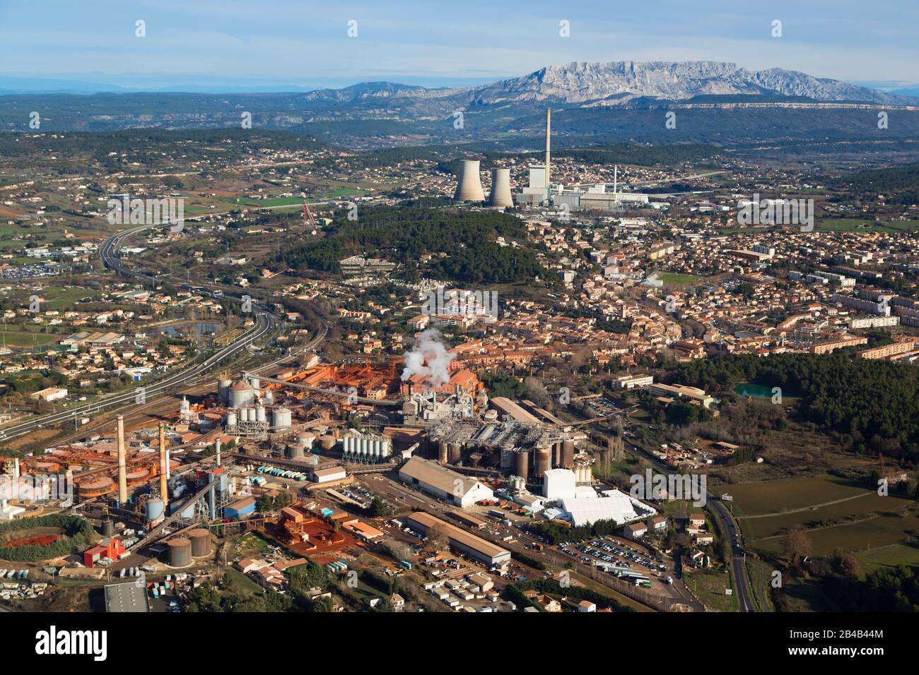 France, Bouches du Rhone, Gardanne, Alteo factory for the production of calcined alumina from bauxite, ocher color, imported from Guinea. whose liquid effluents loaded with soda and heavy metals are discharged into the Calanques National Park of Marseille (aerial view) Stock Photo