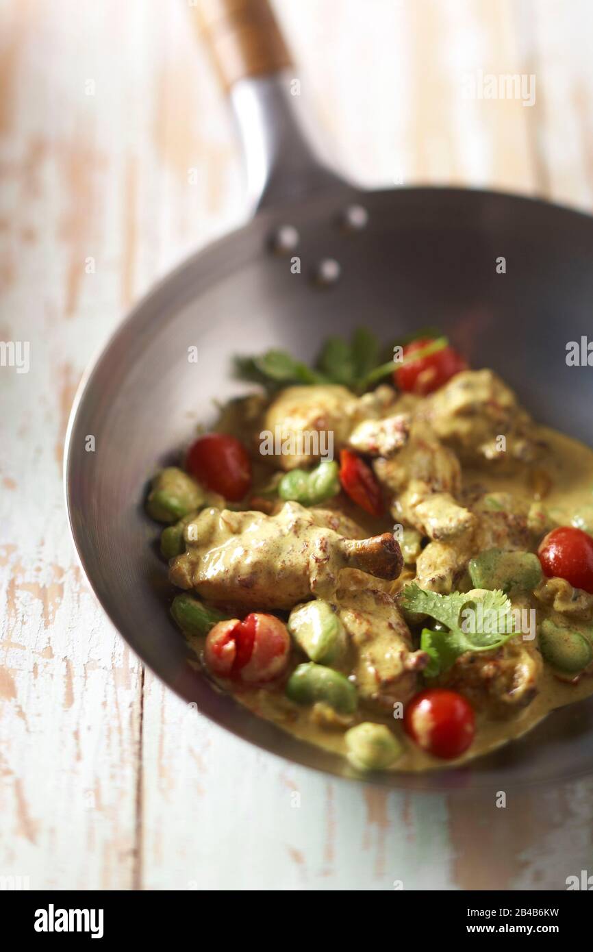 Wok, chicken wing curry Stock Photo