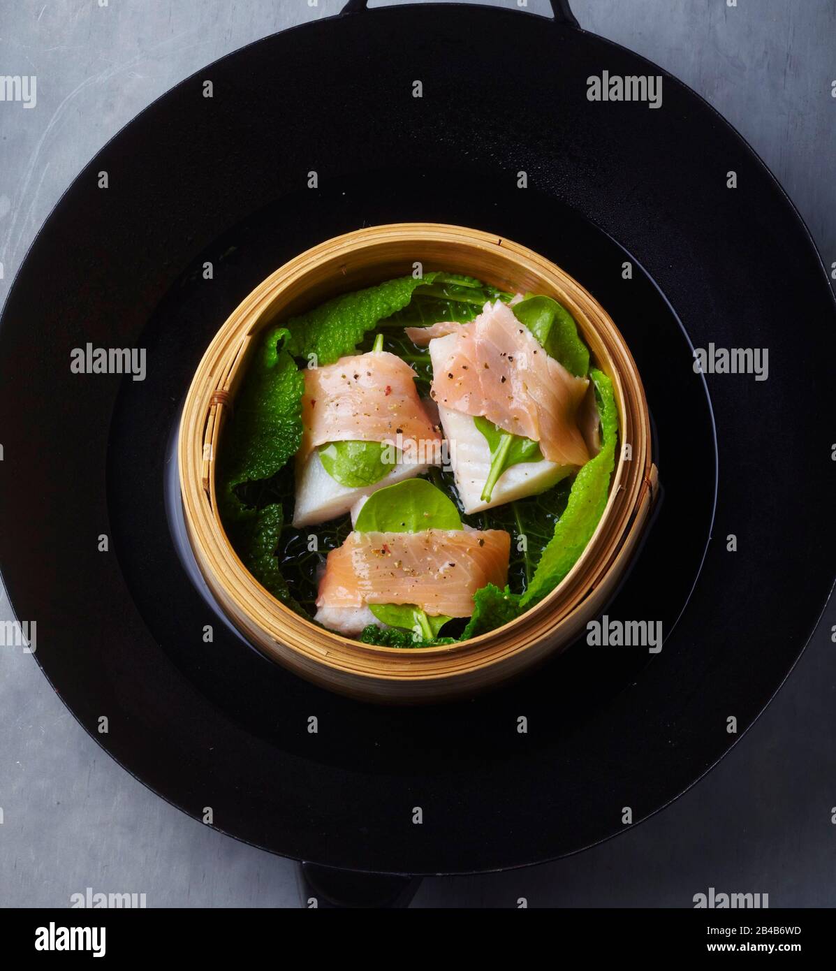 Round Omega Cod Round wok, steamed cod Stock Photo - Alamy