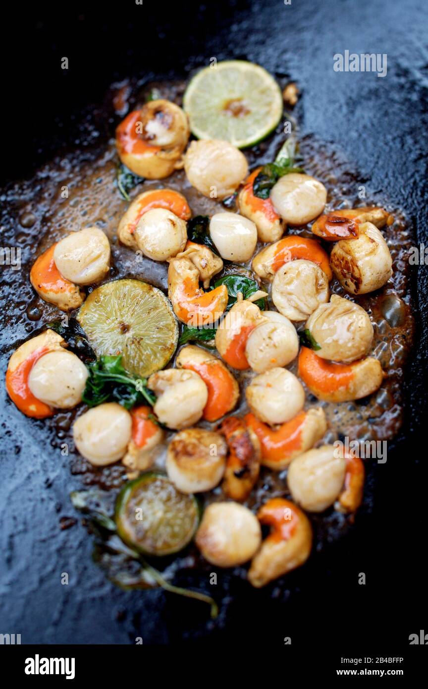 Grilled plancha, scallops with lime and basil Stock Photo Alamy