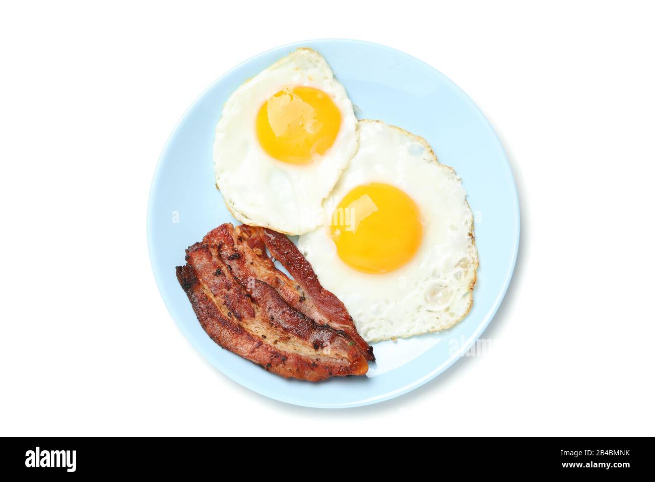 Plate with fried eggs and bacon isolated on white background Stock ...