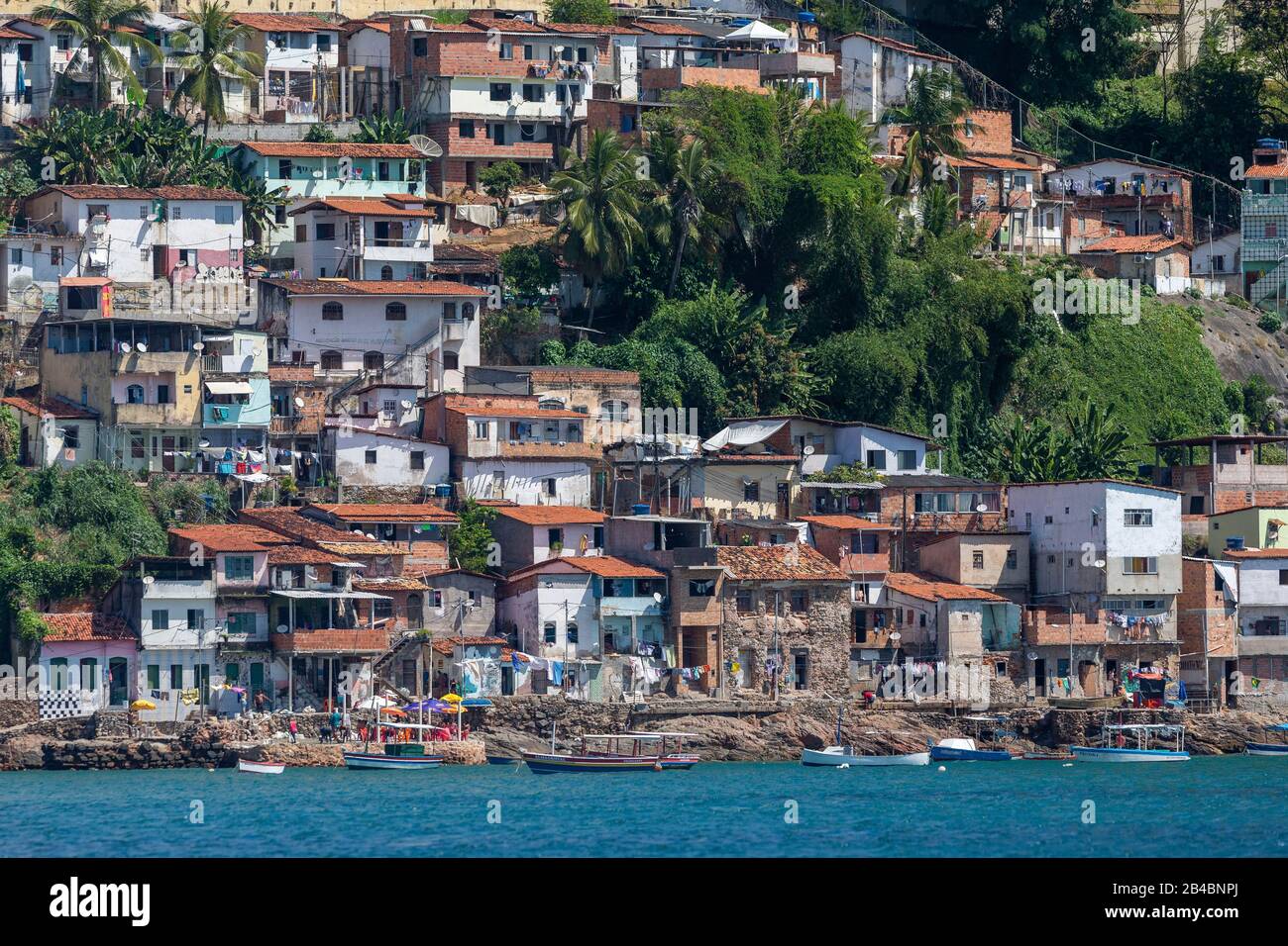 Brazil, State of Bahia, Salvador de Bahia, from Bahia Bay, view of the city and the facades of the popular district of Gamboa Low Stock Photo