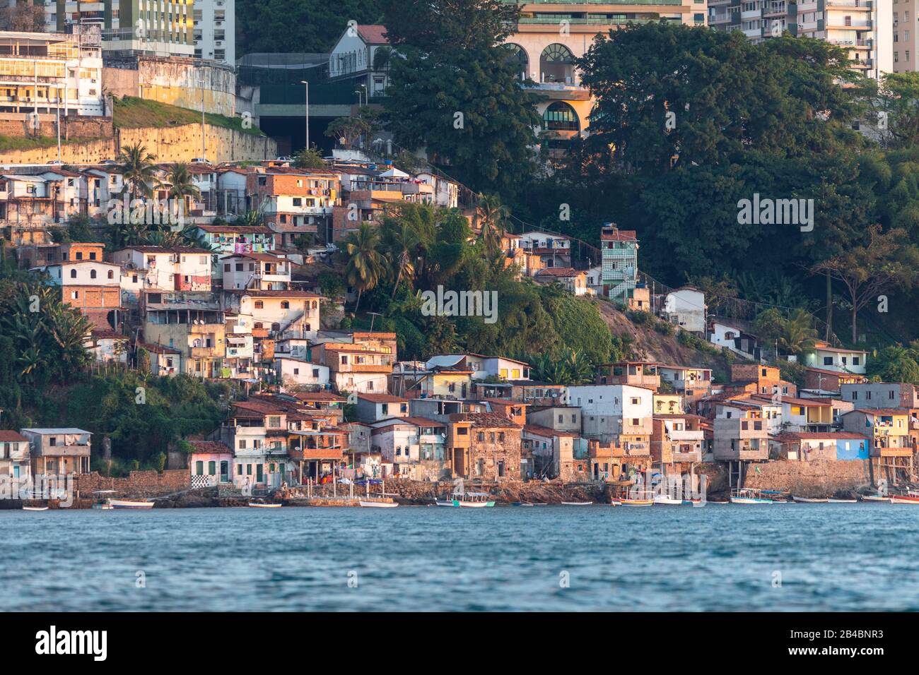 Brazil, State of Bahia, Salvador de Bahia, from Bahia Bay, view of the city and the facades of the popular district of Gamboa Low Stock Photo