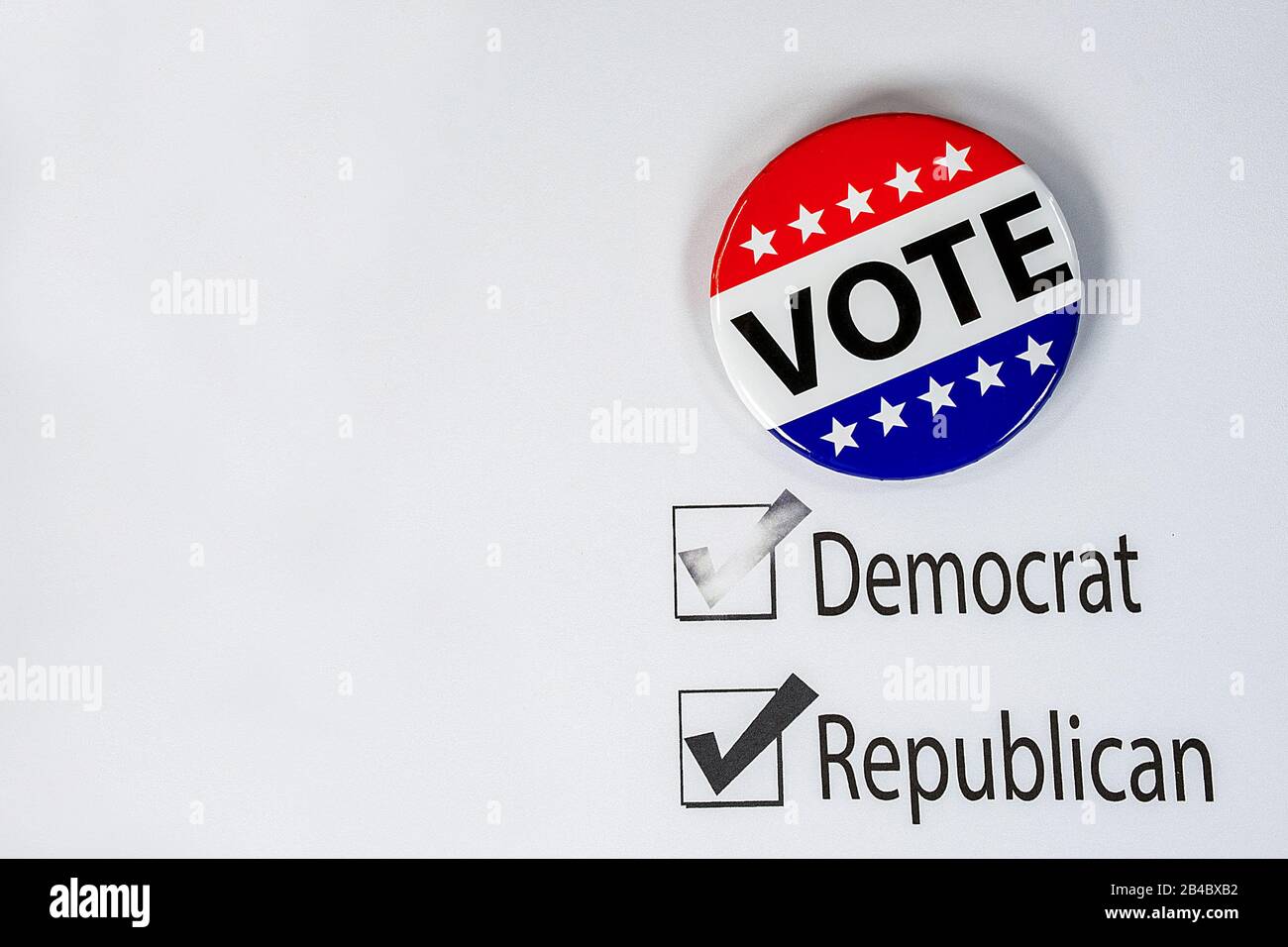 patriotic vote pin on election ballot with check mark on political party choice Stock Photo