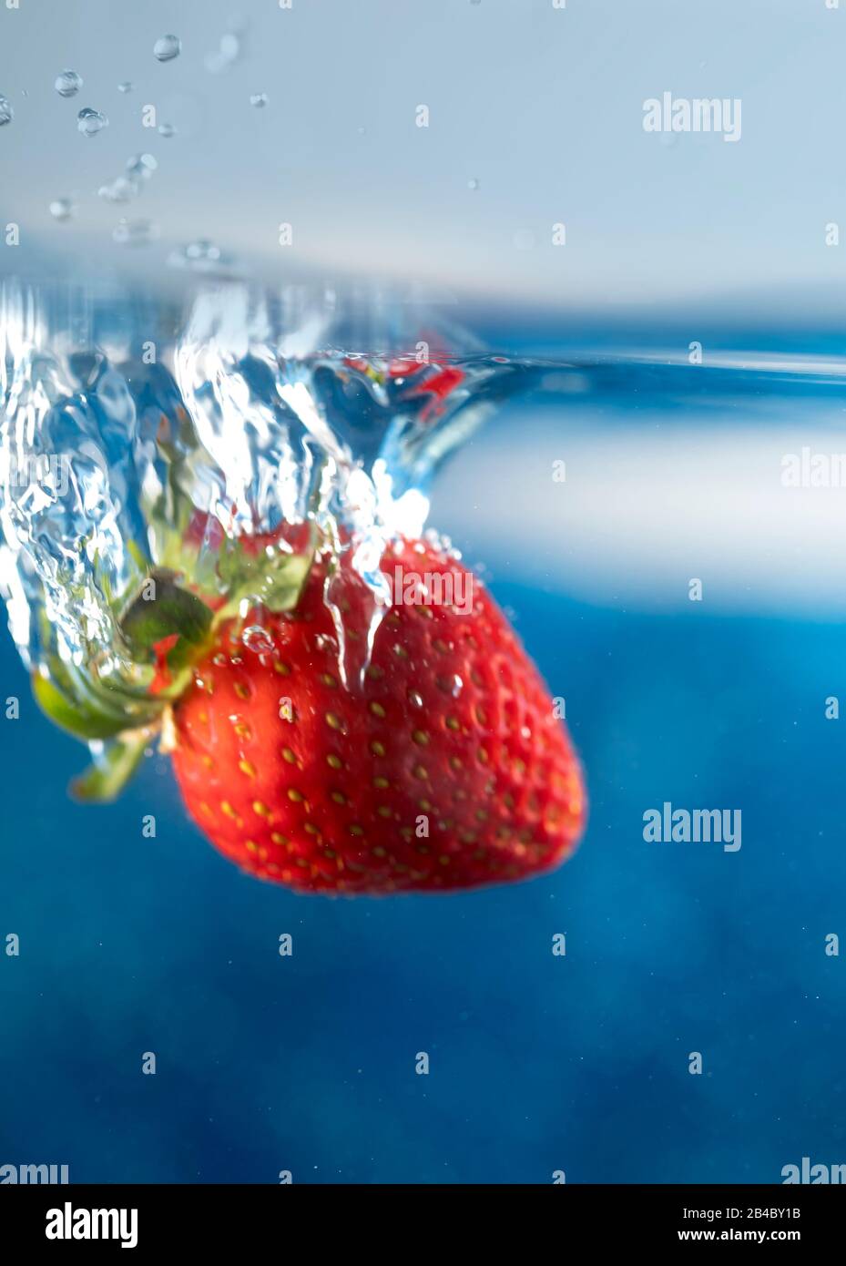 Strawberry splashing in water hi-res stock photography and images - Alamy