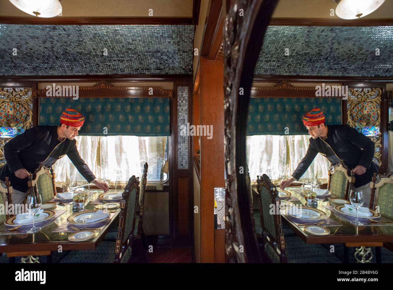 Inside one of the dining cars of the Luxury train Maharajas express train. Rajasthan Jodhpur Rajasthan India. Stock Photo