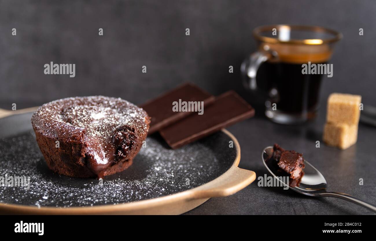 Homemade Chocolate Lava Cake On A Black Plate With A Coffee On A Black Background Stock Photo Alamy