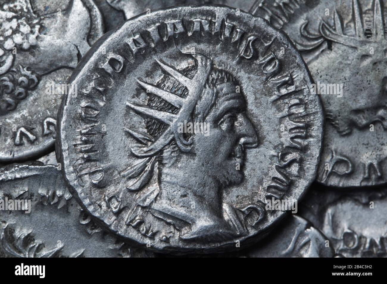 Ancient Roman silver coin showing the portrait of the emperor Stock Photo