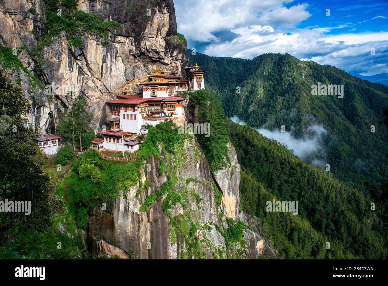 Taktsang Goemba or Tigers nest monastery in Paro valley, Bhutan, Asia. Paro Taktsang or Taktsang Palphug Monastery and the Tiger's Nest is a prominent Stock Photo