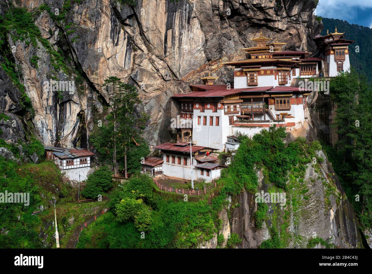 Taktsang Goemba or Tigers nest monastery in Paro valley, Bhutan, Asia. Paro Taktsang or Taktsang Palphug Monastery and the Tiger's Nest is a prominent Stock Photo