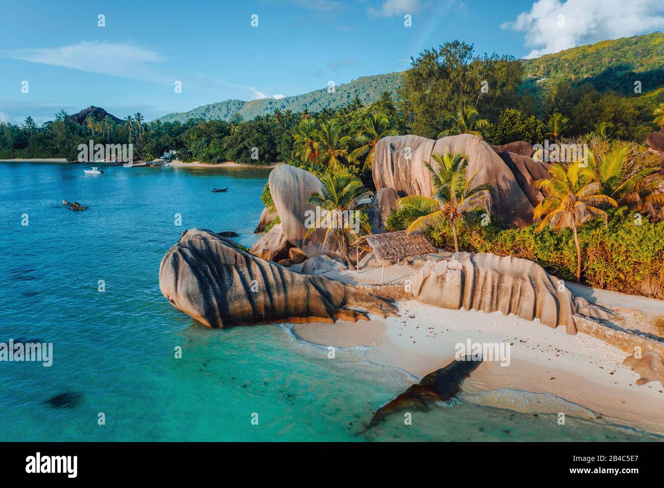 Anse Source d'Argent beach, Seychelles. Aerial drone photo of unique tropical island landscape at warm sunset light. Stock Photo