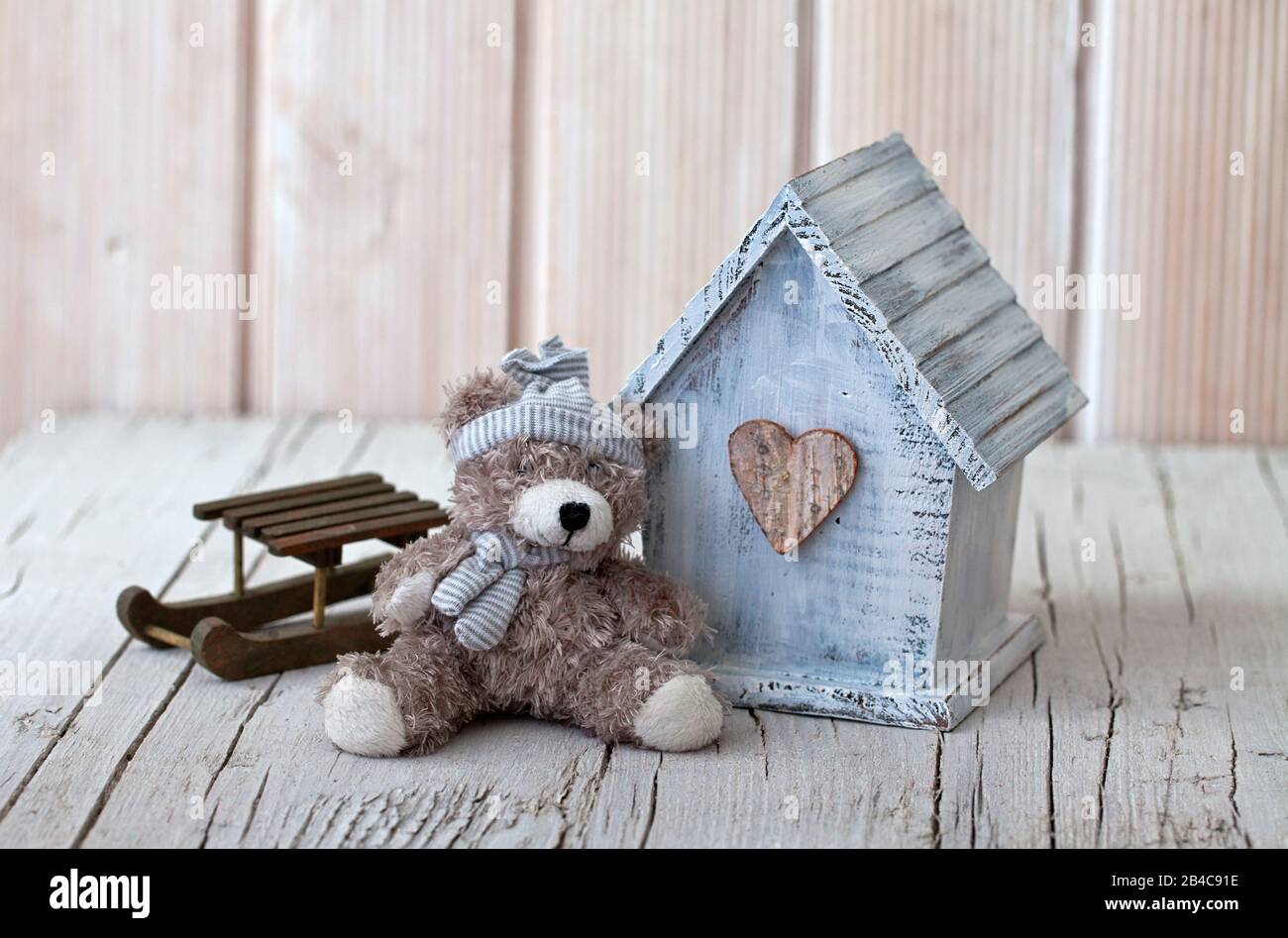 cute little wooden house with teddy bear Stock Photo - Alamy