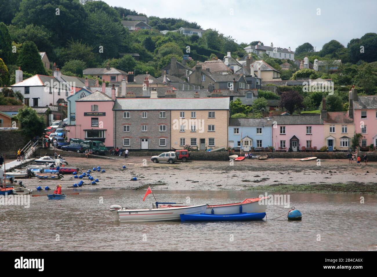 Brightly coloured houses by the river Dittisham from the River Dart