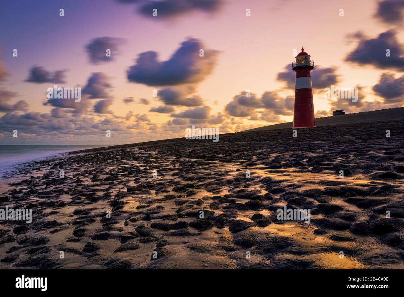 The lighthouse Noorderhooft, also known as Westkapelle Laag is one of the most known Lighthouses in the Netherlands, It was built in 1875. Stock Photo