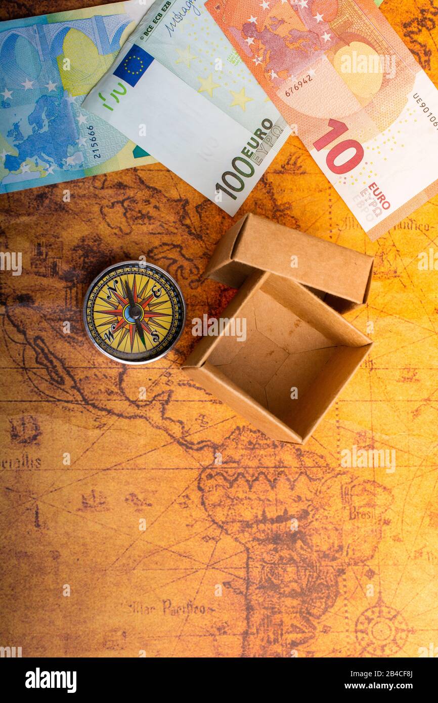 Compass, box and Euro banknotes on map as business concept Stock Photo