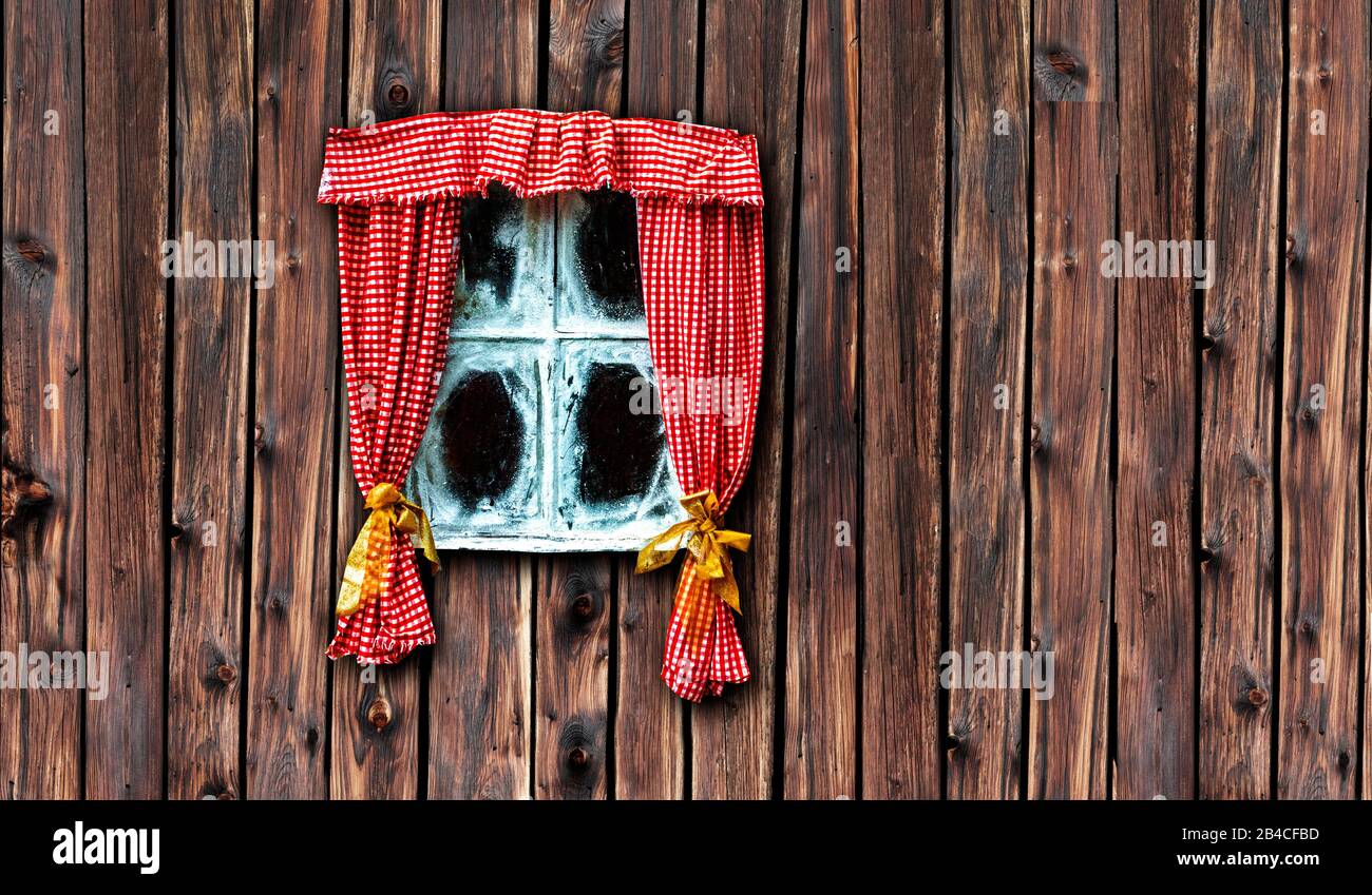 Christmas window with red curtain and ice crystals Stock Photo