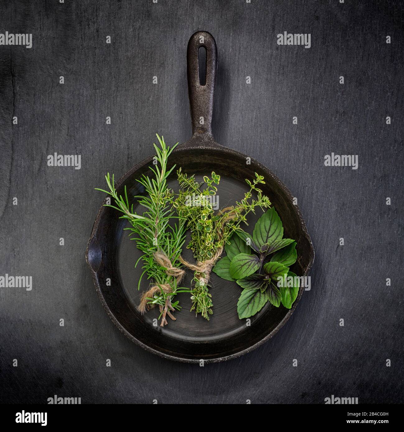 Kitchen herbs in a pan Stock Photo