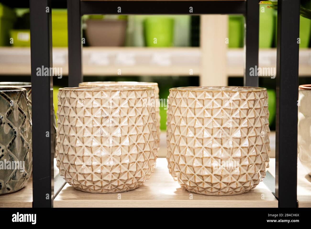 Stylish ceramic flower pots in a store on a shelf Stock Photo Alamy