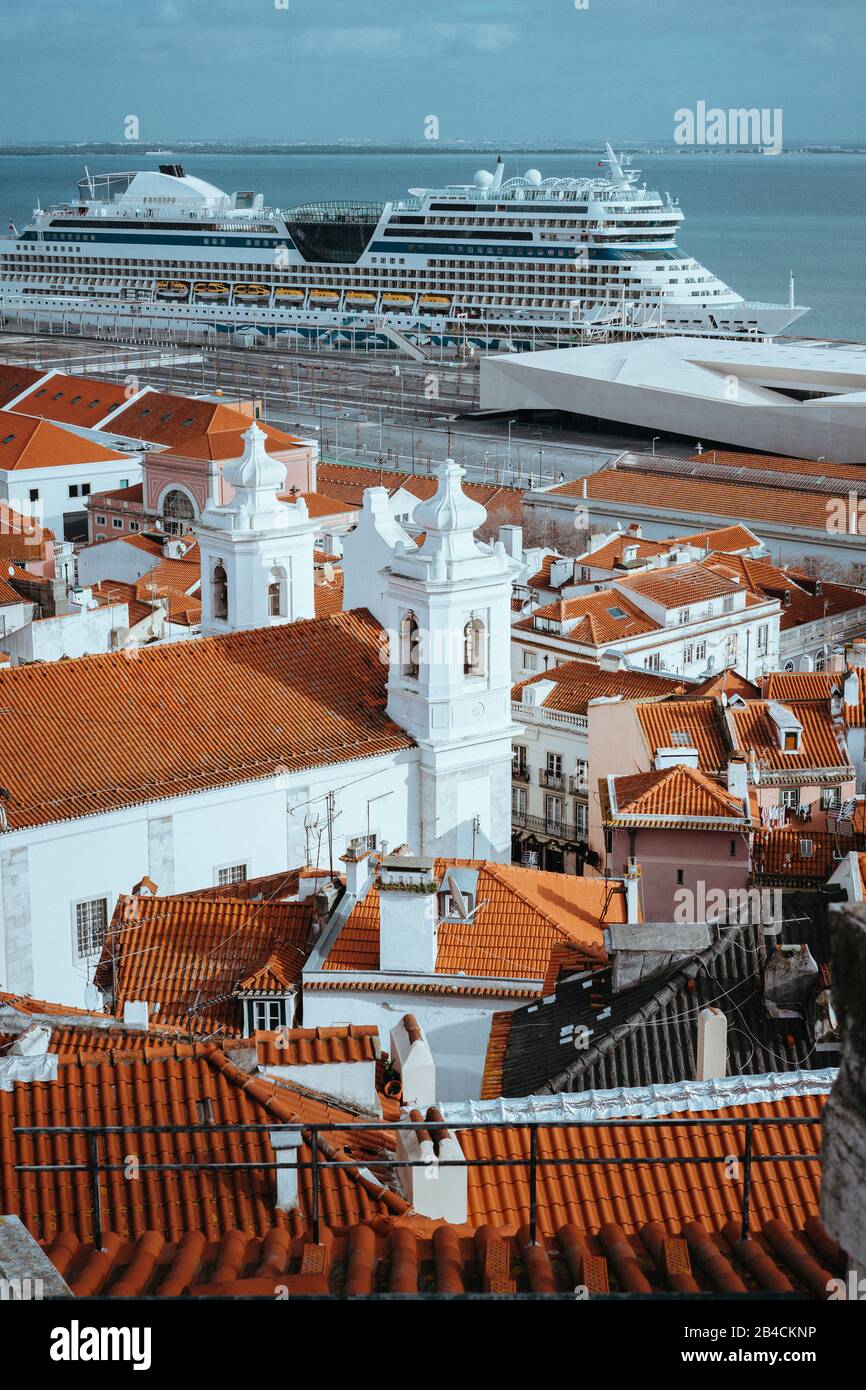 Rooftops, church of Alfama district in Lisbon. Cruise boat AIDA on the Tagus River. Lisbon, Lisboa, Lissabon, Portugal, Europe Stock Photo