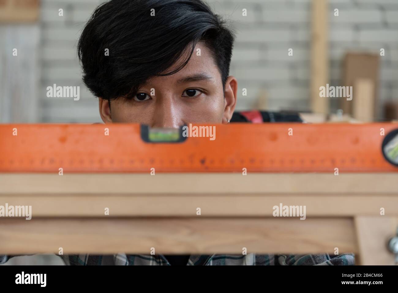 Carpenter working on wood craft at to produce construction