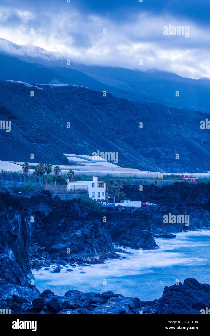 Spain, Canary Islands, La Palma Island, Puerto Naos, banana plantation and mountains, dawn Stock Photo