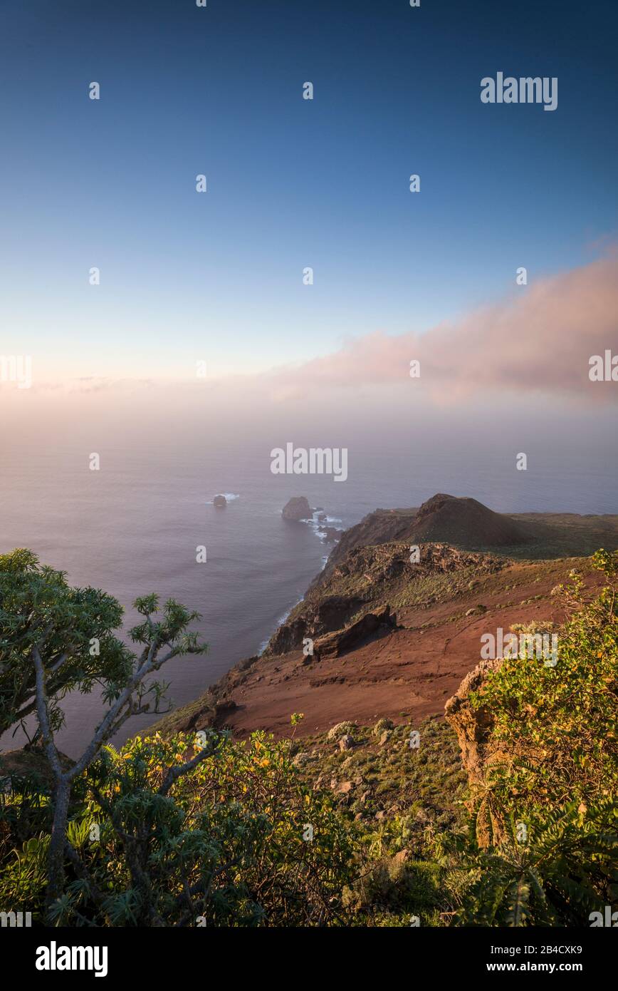 Spain, Canary Islands, El Hierro Island, Guarazoca, Mirador de la Pena, elevated sunset view of the northwest coast Stock Photo