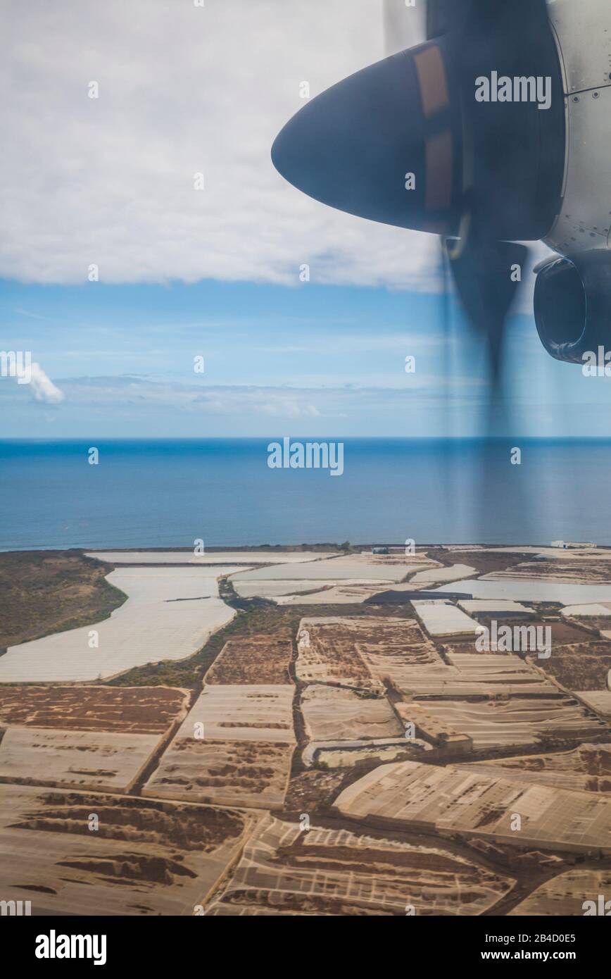Spain, Canary Islands, Gran Canaria Island, propeller-engined plane landing above coastal banana plantations Stock Photo