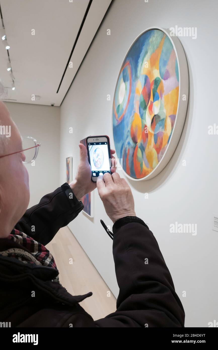 Visitors Viewing Paintings at the Museum of Modern Art, NYC Stock Photo