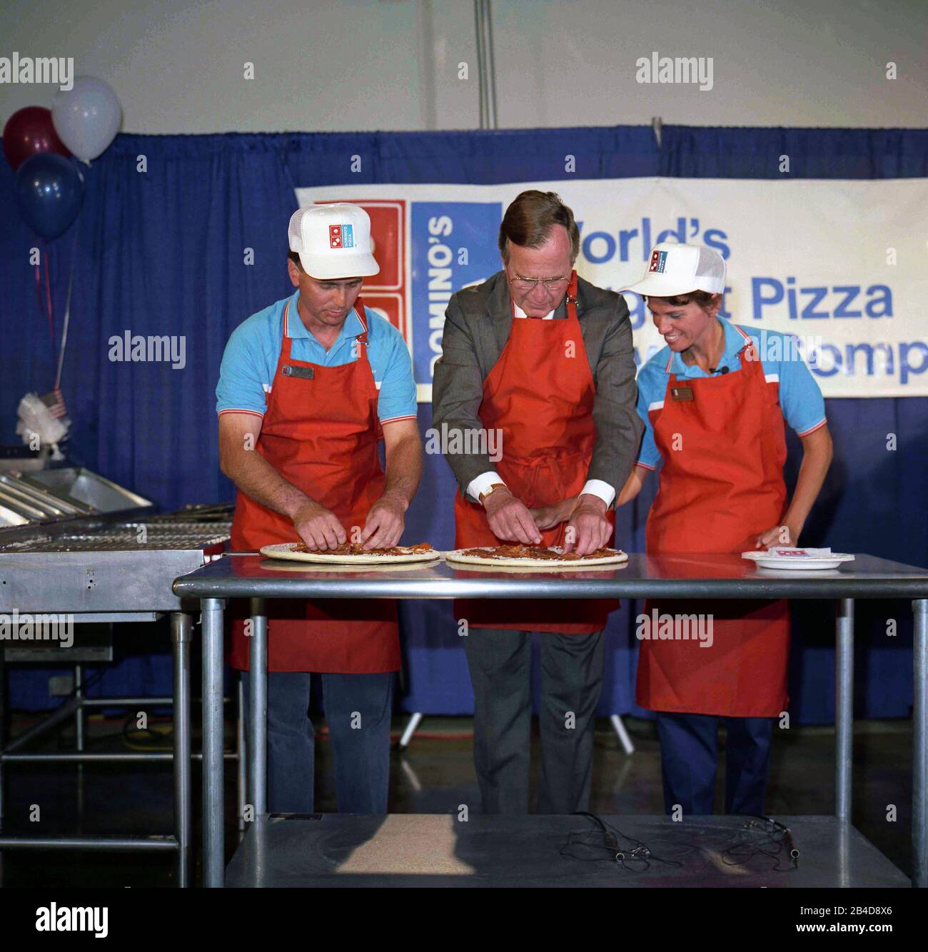 President George Bush making a pizza at a rally in California 1988 Stock Photo