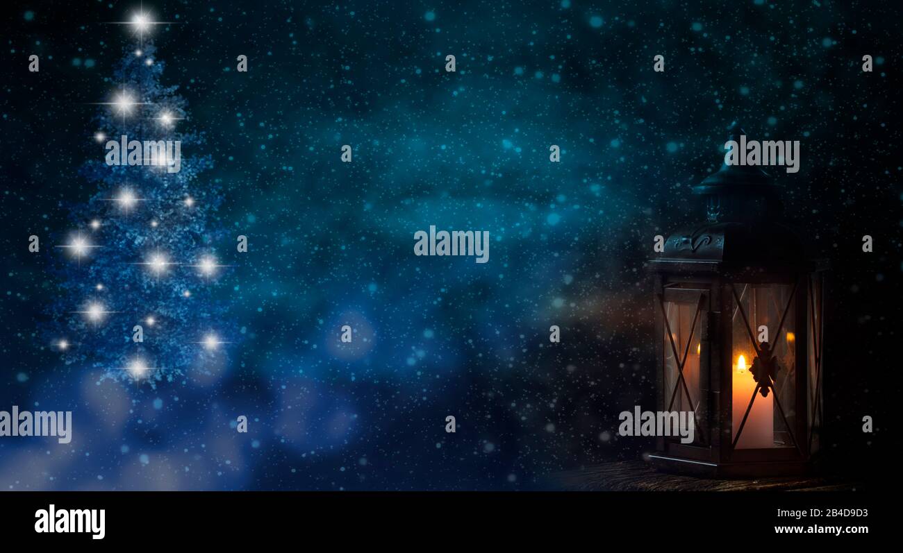 Christmas tree and lantern in cold winter night with snow Stock Photo
