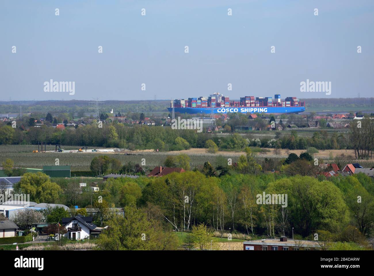 Europe, Germany, Lower Saxony, Stade, Hamburg metropolitan region, Hanseatic city, view from above towards the Elbe and container ship of the Cosco Shipping Line, Stock Photo
